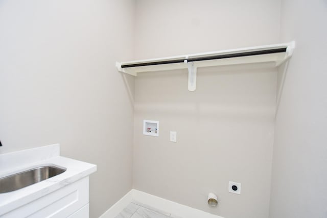 laundry area with electric dryer hookup, washer hookup, baseboards, and light marble finish flooring