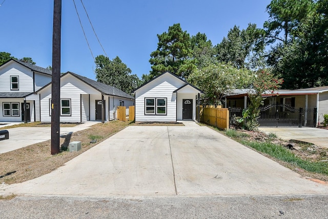 ranch-style house with fence