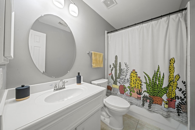 full bathroom with tile patterned flooring, toilet, vanity, and shower / bath combo with shower curtain