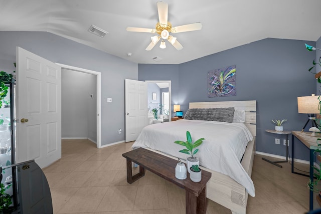 bedroom with lofted ceiling, ceiling fan, light tile patterned floors, and baseboards