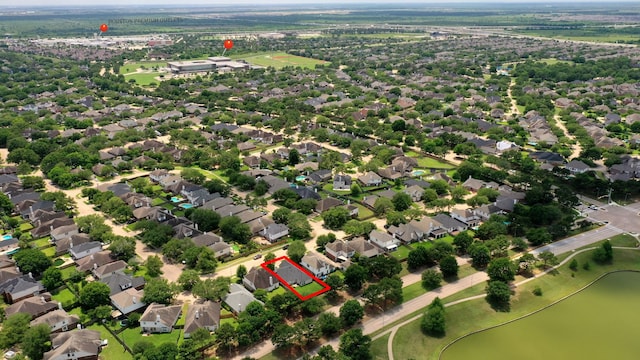 aerial view of property's location featuring property boundaries highlighted and nearby suburban area
