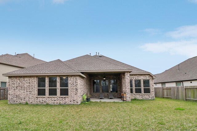 531 Campbell Dr, League City, TX 77573 - back of property with brick siding, ceiling fan, a patio area, and roof with shingles