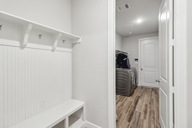 531 Campbell Dr, League City, TX 77573 - clothes washing area with independent washer and dryer, wood finished floors, and baseboards