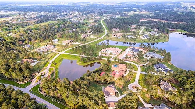 1 Steeldust Ct, Tomball, TX 77377 - aerial overview of property's location with a nearby body of water and nearby suburban area