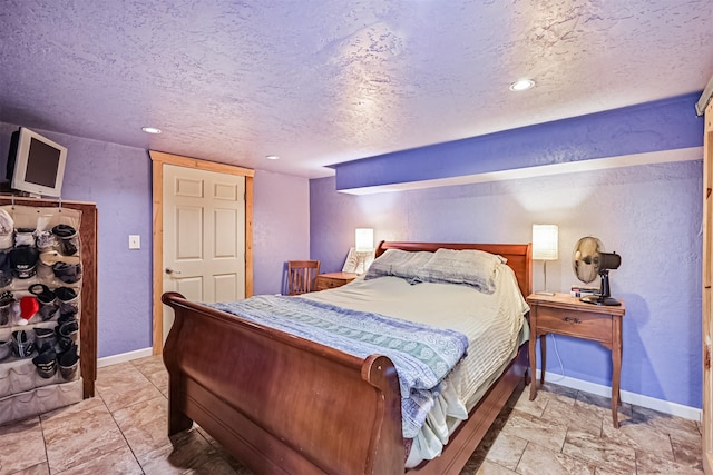 5005 Avenue N Rear Ave N, Rear, Galveston, TX 77551 - bedroom with a textured ceiling, baseboards, a textured wall, and recessed lighting