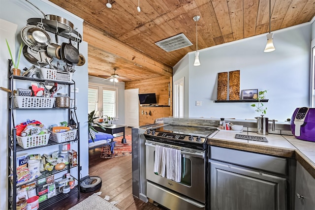 5005 Avenue N Rear Ave N, Rear, Galveston, TX 77551 - kitchen featuring wood ceiling, stainless steel electric range oven, a ceiling fan, wood-type flooring, and wooden walls