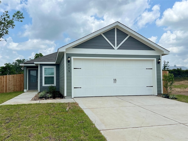 425 Tejas Trl, Waller, TX 77484 - ranch-style house with driveway, an attached garage, and a shingled roof
