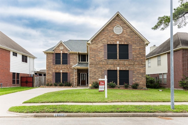 traditional-style home with brick siding