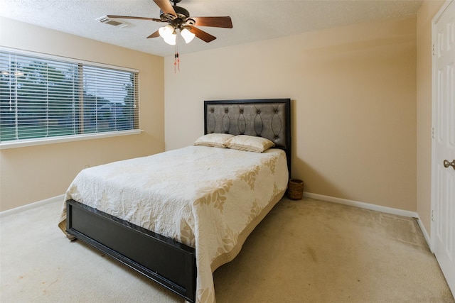 bedroom with carpet floors, baseboards, and ceiling fan