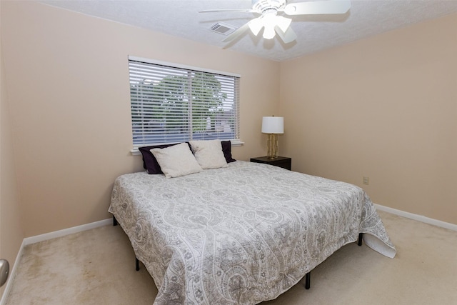 bedroom with carpet flooring, baseboards, and ceiling fan