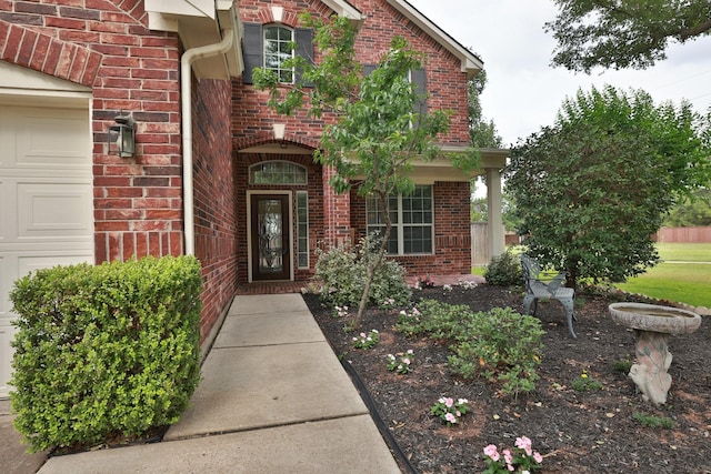 10606 Maidstone Manor Ct, Spring, TX 77379 - property entrance featuring brick siding and an attached garage
