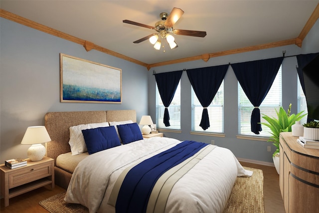 10606 Maidstone Manor Ct, Spring, TX 77379 - bedroom featuring crown molding, baseboards, wood finished floors, and a ceiling fan