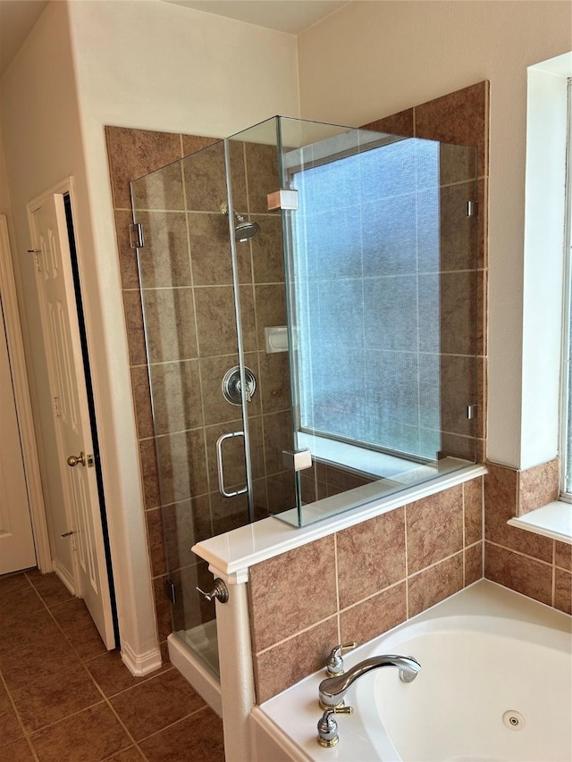 10606 Maidstone Manor Ct, Spring, TX 77379 - bathroom featuring a whirlpool tub, a shower stall, and tile patterned flooring