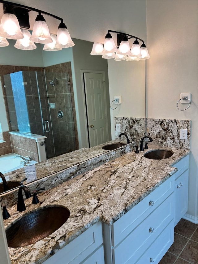 10606 Maidstone Manor Ct, Spring, TX 77379 - bathroom featuring double vanity, a shower stall, tile patterned floors, a garden tub, and a chandelier