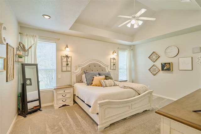 7503 Revelwood Dr, Magnolia, TX 77354 - bedroom with light carpet, baseboards, lofted ceiling, and ceiling fan