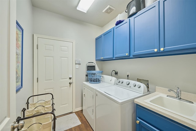 7503 Revelwood Dr, Magnolia, TX 77354 - washroom with cabinet space, separate washer and dryer, dark wood-type flooring, and baseboards