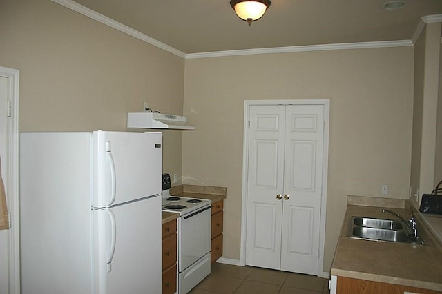 104 Longstreet Rd, Willis, TX 77378 - kitchen featuring white appliances, a sink, ornamental molding, dark tile patterned floors, and under cabinet range hood