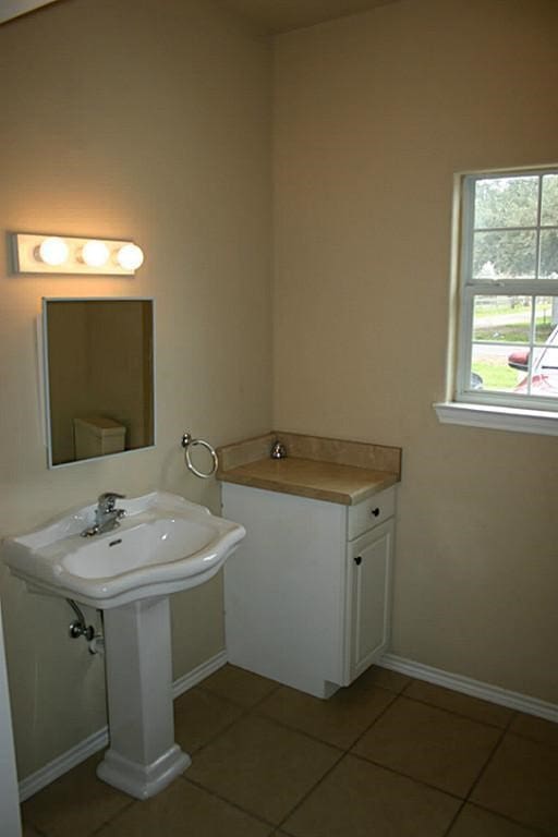104 Longstreet Rd, Willis, TX 77378 - bathroom featuring tile patterned flooring and baseboards