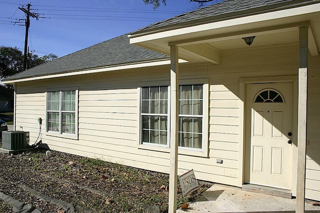 104 Longstreet Rd, Willis, TX 77378 - view of side of property with a shingled roof and central AC