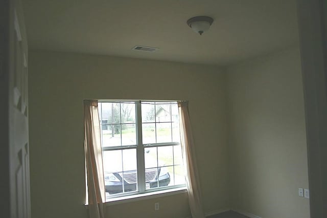 104 Longstreet Rd, Willis, TX 77378 - empty room with healthy amount of natural light and baseboards