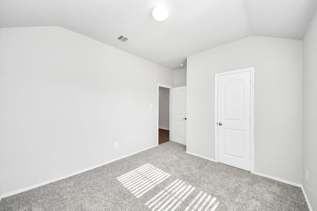 4727 Lombardy Fire Trl, Katy, TX 77449 - unfurnished bedroom with vaulted ceiling, carpet, and baseboards