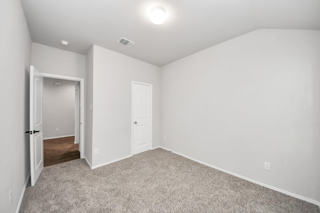 4727 Lombardy Fire Trl, Katy, TX 77449 - unfurnished bedroom with carpet, baseboards, and vaulted ceiling