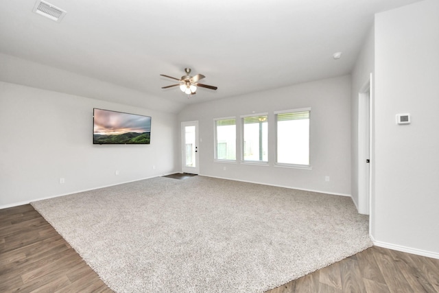 4727 Lombardy Fire Trl, Katy, TX 77449 - unfurnished living room with baseboards, ceiling fan, wood finished floors, and carpet floors