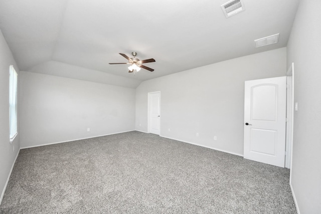 4727 Lombardy Fire Trl, Katy, TX 77449 - empty room with vaulted ceiling, carpet, a ceiling fan, and baseboards