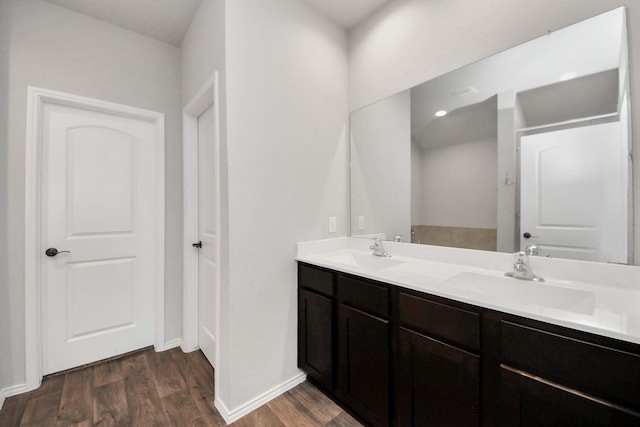 4727 Lombardy Fire Trl, Katy, TX 77449 - full bathroom with wood finished floors, baseboards, and double vanity