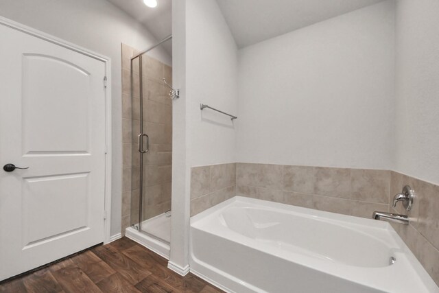 4727 Lombardy Fire Trl, Katy, TX 77449 - bathroom with wood finished floors, a shower stall, and a bath