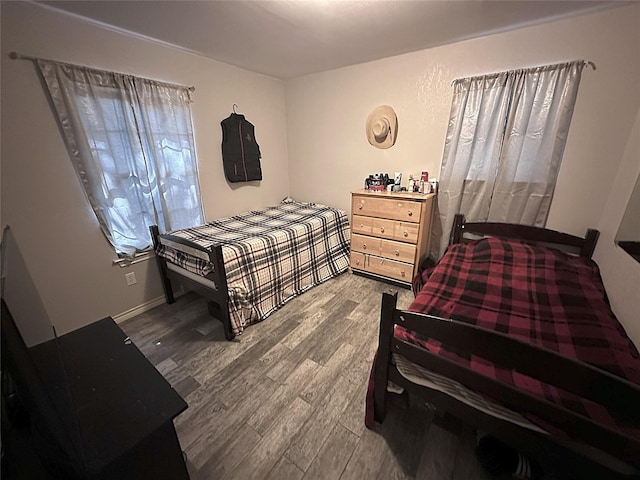 bedroom with wood finished floors