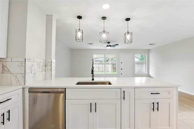 5318 Cilantro Ln, Baytown, TX 77521 - kitchen featuring dishwasher, a sink, a ceiling fan, white cabinets, and recessed lighting