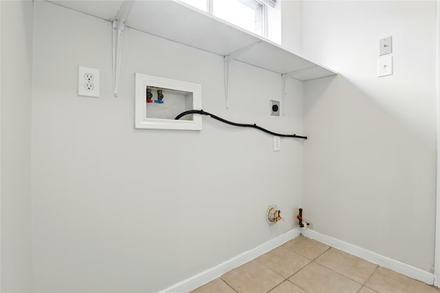 5318 Cilantro Ln, Baytown, TX 77521 - washroom with gas dryer hookup, hookup for a washing machine, hookup for an electric dryer, light tile patterned floors, and baseboards