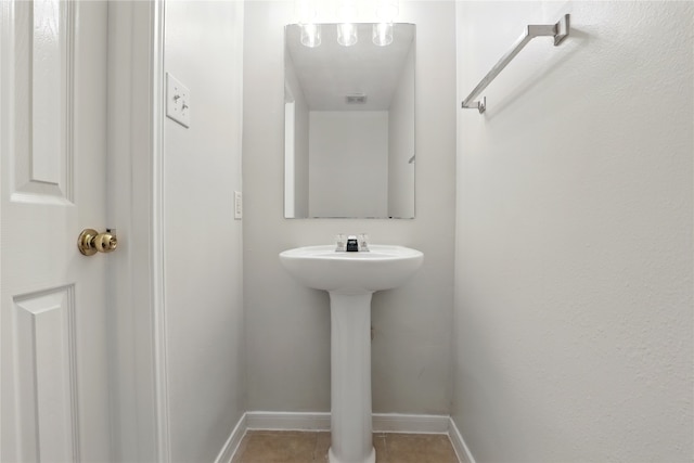 5318 Cilantro Ln, Baytown, TX 77521 - bathroom with tile patterned flooring and baseboards