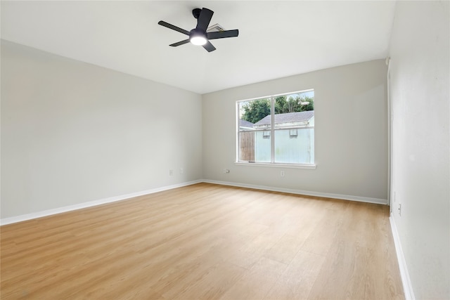 5318 Cilantro Ln, Baytown, TX 77521 - spare room with light wood-style floors, baseboards, and a ceiling fan