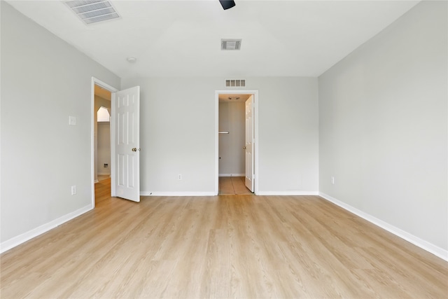 5318 Cilantro Ln, Baytown, TX 77521 - unfurnished bedroom with light wood-type flooring, baseboards, and a ceiling fan