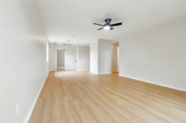 5318 Cilantro Ln, Baytown, TX 77521 - spare room with ceiling fan, light wood-style floors, and baseboards