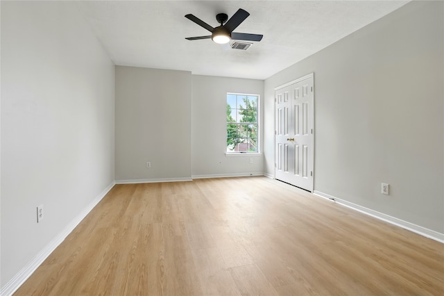 5318 Cilantro Ln, Baytown, TX 77521 - unfurnished bedroom with light wood-style floors, baseboards, a closet, and ceiling fan