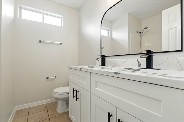 5318 Cilantro Ln, Baytown, TX 77521 - bathroom with toilet, tile patterned floors, baseboards, vanity, and a shower