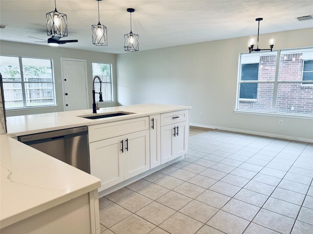 5318 Cilantro Ln, Baytown, TX 77521 - kitchen with a sink, dishwasher, hanging light fixtures, light tile patterned floors, and a chandelier