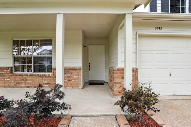 5318 Cilantro Ln, Baytown, TX 77521 - property entrance featuring brick siding and covered porch