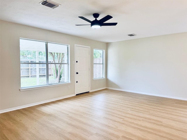 5318 Cilantro Ln, Baytown, TX 77521 - spare room with light wood-style floors, baseboards, and ceiling fan