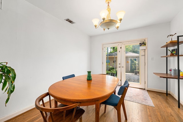 863 W 43rd St, Houston, TX 77018 - dining room featuring a chandelier, light wood finished floors, french doors, and baseboards