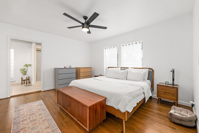 863 W 43rd St, Houston, TX 77018 - bedroom featuring wood finished floors, baseboards, and a ceiling fan