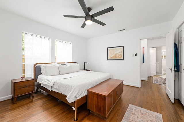 863 W 43rd St, Houston, TX 77018 - bedroom with multiple windows, baseboards, and wood finished floors