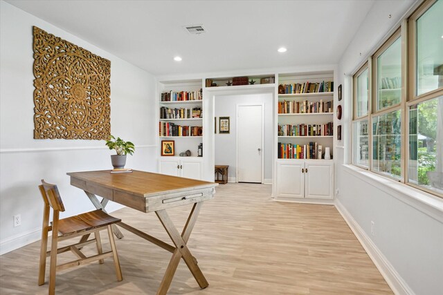 5402 Indigo St, Houston, TX 77096 - dining room with light wood-style flooring, baseboards, built in shelves, and recessed lighting