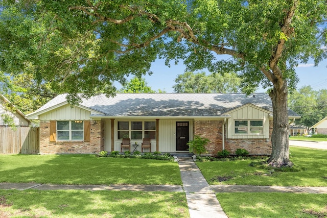 5402 Indigo St, Houston, TX 77096 - ranch-style home with brick siding, roof with shingles, and covered porch
