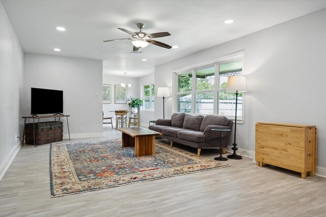 5402 Indigo St, Houston, TX 77096 - living room featuring light wood-style flooring, baseboards, ceiling fan, and recessed lighting