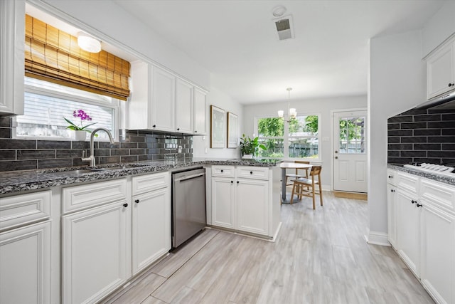 5402 Indigo St, Houston, TX 77096 - kitchen with dishwasher, a sink, tasteful backsplash, white cabinetry, and light wood-style flooring