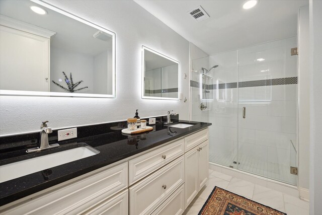 5402 Indigo St, Houston, TX 77096 - full bathroom with a shower stall, double vanity, and recessed lighting